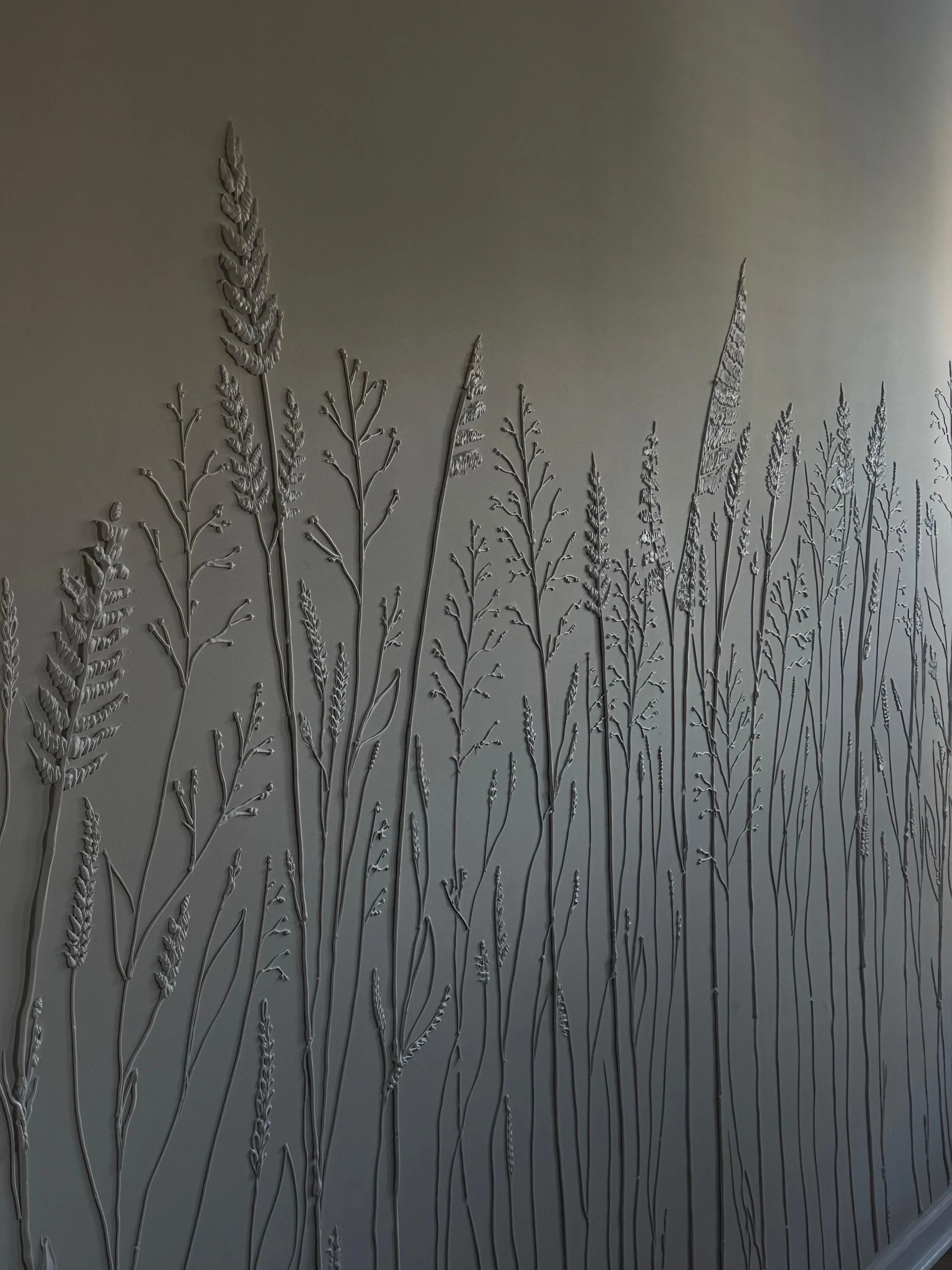 Close process detail of sculptural botanical relief